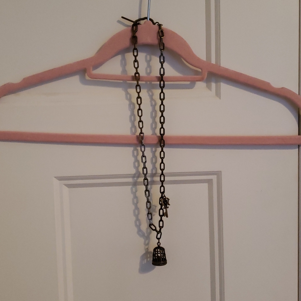 Bird in cage necklace